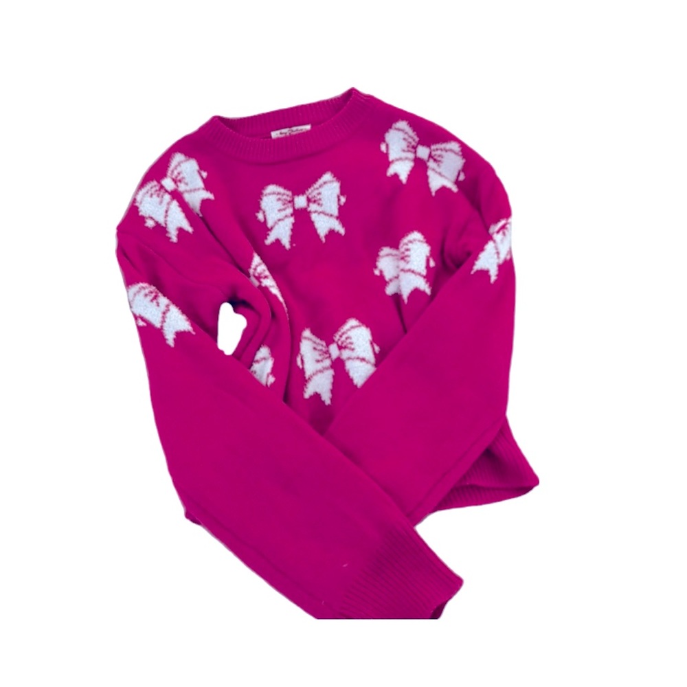 Hot pink sweater with white bows.